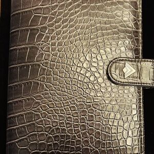 Address book in brown leather look .  Complete with pockets for cards.